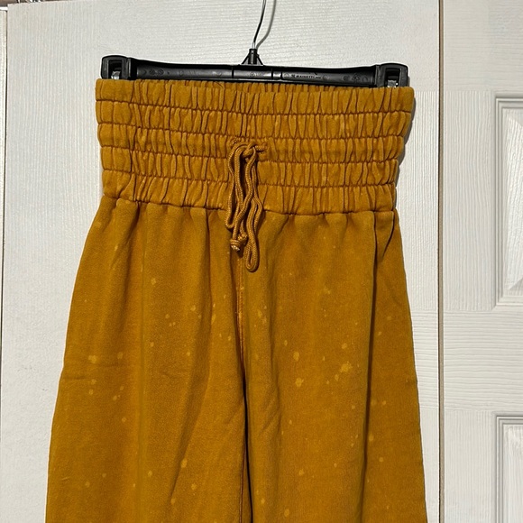Mustard Urban Outfitters Puffy Pants with light bleach spots. - Picture 2 of 9